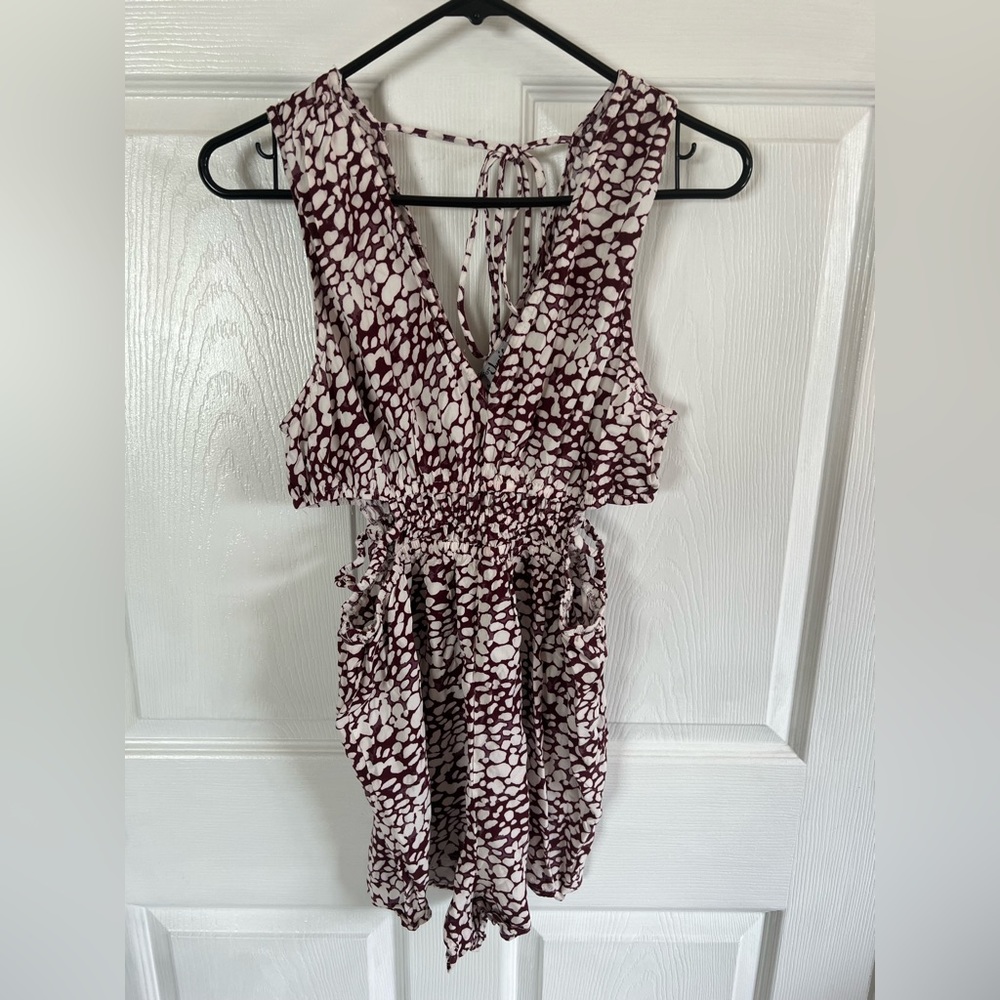Size large romper, perfect for summer occasion v-shape front and back